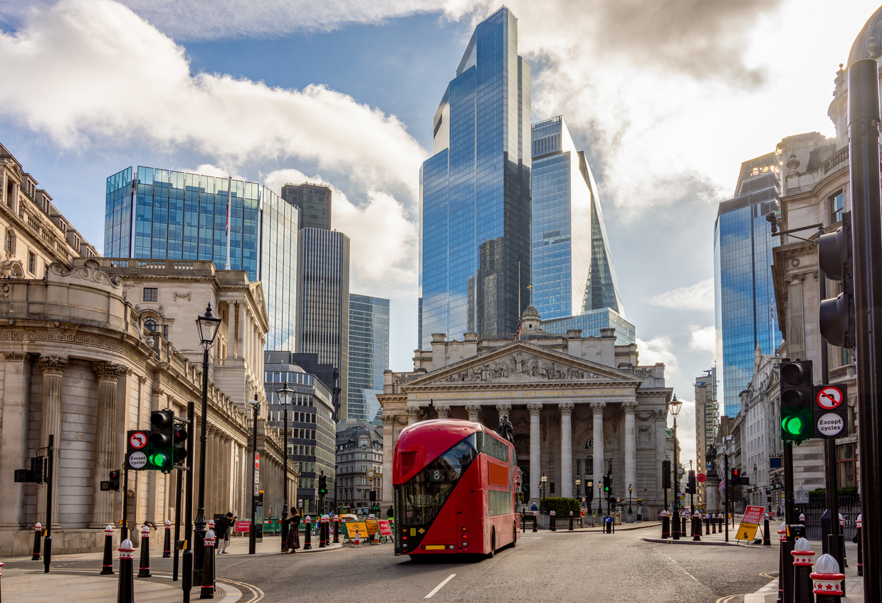 Royal Exchange building and skyscrapers in City of London, UK